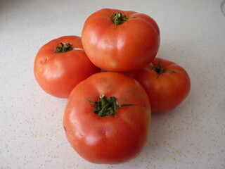 The Essence of Simplicity: A Cluster of Ripe Tomatoes Representing Nature's Abundance and the Cycle of Growth and Nourishment