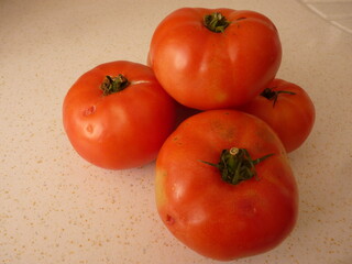 The Essence of Simplicity: A Cluster of Ripe Tomatoes Representing Nature's Abundance and the Cycle of Growth and Nourishment
