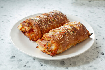 A view of two strombolis on a plate.