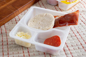 A view of a pizza building lunch kit.