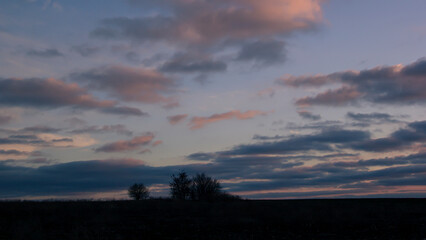 Lines of dramatic clouds at sunset, autumn