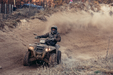 Quad bike. Cross-country quad bike, extreme sports. ATV Bike speed. Man riding ATV vehicle on off road track. People aoutdoor sport activities theme. © Leszek Szelest