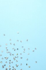 Beautiful silver confetti on a color background