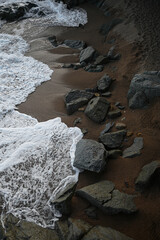 Waves crashing over the rocky shore of the Mediterranean Sea in Sant Pol de Mar (Spain)