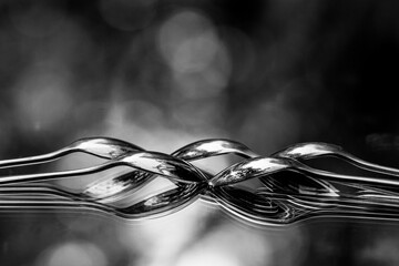 overlapping spoons reflected in mirror