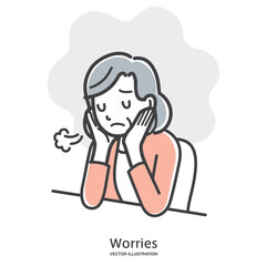 ため息をつき落ち込む年配の女性