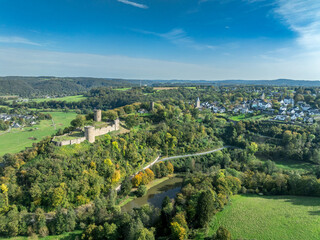 Aerial view of Blankenberg Stadt with city walls, city gate and castle restored medieval village with hilltop castle above the Sieg river in Germany