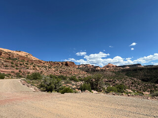Mesa view red rocks blue sky with clouds Moab Utah