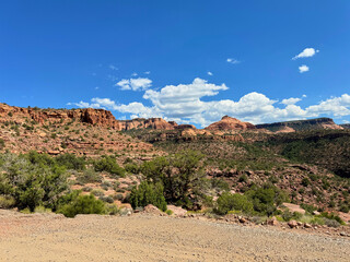 Mesa view red rocks blue sky with clouds Moab Utah