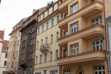 The facades of urban residential buildings exhibit a variety of distinct architectural styles and designs