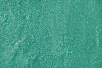 Stucco plaster surface, brushstroke background, close up, macro texture of green painted cement, concrete wall texture. Wallpaper, backdrop, architecture design element