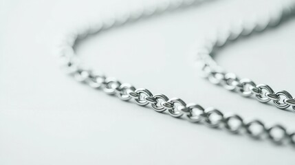 Obraz premium Silver chains isolated on white background, symbol of strength and connection