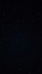 An inky black night sky with scattered white and yellow stars for a sense of depth, deep space, starry