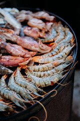 Grilled shrimp and seafood sizzling on a hot plate for a gourmet culinary experience