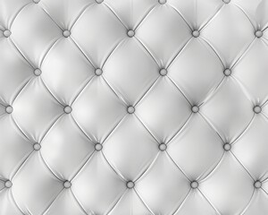 Close-up of white tufted upholstery with diamond-shaped buttons