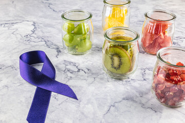 Food against diseases and cancer. A purple ribbon, concept of fight and prevention against cancer.
