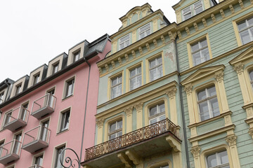 Vibrantly colored buildings exhibiting unique architectural features in a lively urban setting