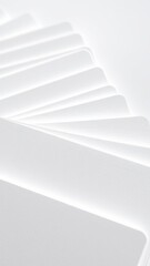 Obraz premium Close-up of the texture of individual card blanks scattered on a white surface, artistic presentation, focus on details, everyday objects, natural light,