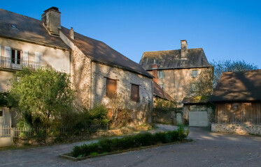 Street of traditional retro french houses in the low Autumn sunshine