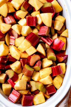 Apple rhubarb crisp in an oval baking dish
