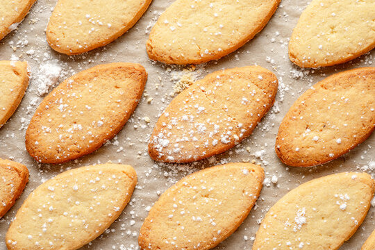 Homemade rustic biscuits. Some ingredients are: eggs; sugar; flour; butter. Top View