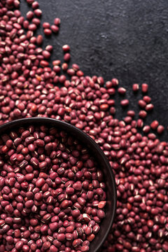 Adzuki beans in a bowl on black backdrop