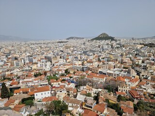 Obraz premium Scenic View of Athens, Greece from the Acropolis with Orange Rooftops and Distant Hills