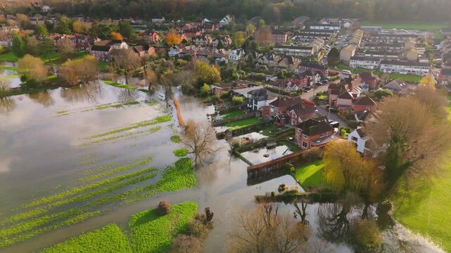 Aerial shot showing flooded fields and gardens of residential properties when the River Avon burst its banks after the heavy rain of Storm Bert.