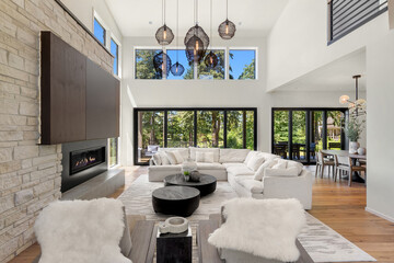 Living Room with Fireplace and Wall of Windows in Stunning Modern Luxury Home