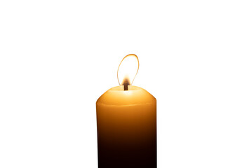 A single burning candle flame or light glowing on a big white candle isolated on white background with clipping path
