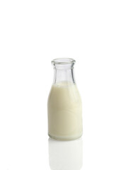 Old fashioned bottle of milk on white background 