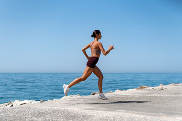 Running along the Seaside in the Morning Light