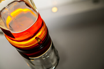 High-Quality Close-Up of a Bottle of Golden Whiskey Capturing Luxury, Richness, and Sophistication...