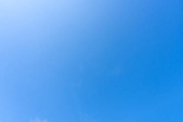 Low angle view and full frame of beautiful blue sky without clouds in the morning or evening used as natural background texture in decorative art work