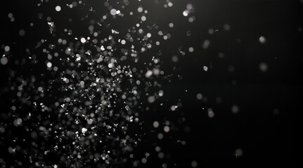 white glitter particles on a black elegant background