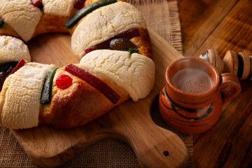 Rosca de Reyes, also called Kings cake, roscon, Epiphany Cake and hot chocolate drink. Mexican...