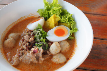 Pork noodle tom yum with condensed water egg.