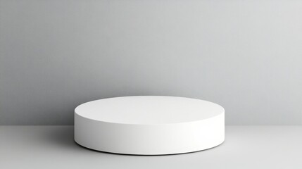 White Cylindrical Display Platform Against Grey Background