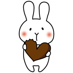 バレンタインのチョコレートを食べる白いうさぎ