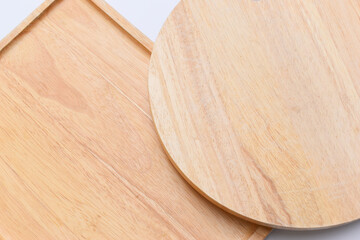 brown wooden tray and sphere cuttingboard isolated on white background