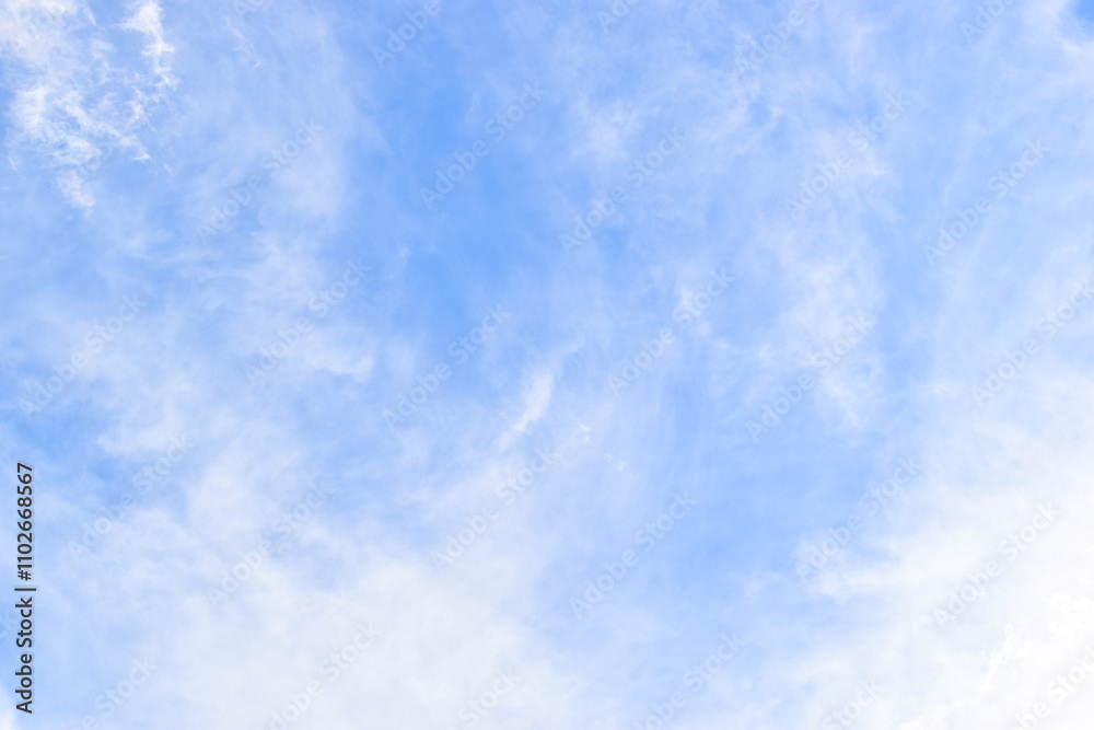Wall mural beautiful blue sky and white fluffy group of clouds with sunrise in the morning, natural background