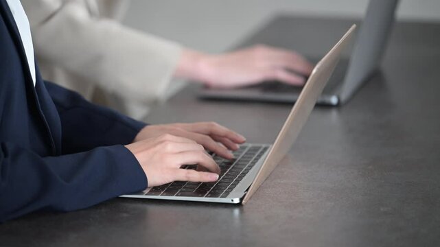 Animation of business meeting image typing on computer Close-up of hand without face