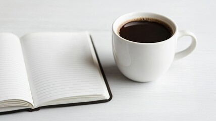 A cozy setting featuring a cup of coffee next to an open notebook, perfect for writing or enjoying a peaceful moment.