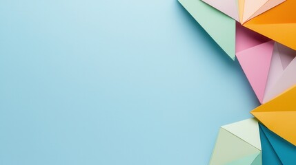 Fototapeta premium Organization structure and mission, A colorful arrangement of paper shapes on a light blue background, creating a vibrant and artistic composition.