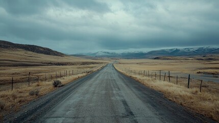 Empty road in a remote area, with no traffic or people, creating a sense of solitude