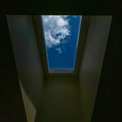 Blue Sky and White Clouds Seen Through a Skylight