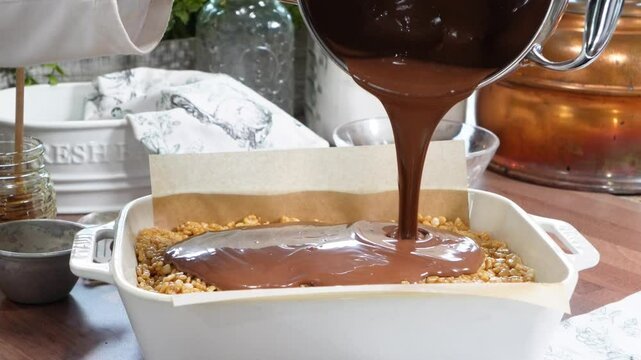 Baking rice krispy treats with butterscotch and chocolate on top. Fun chocolate sweet treats for grown ups and kids.  Chocolate rice krispy treats.