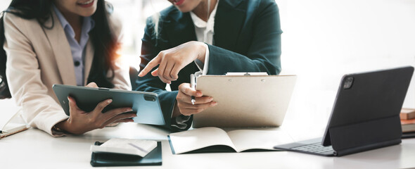 Cropped shot of diverse coworkers working together in boardroom, brainstorming, discussing and analyzing business strategy..