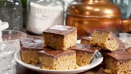 Baking rice krispy treats with butterscotch and chocolate on top. Fun chocolate sweet treats for grown ups and kids.  Chocolate rice krispy treats.