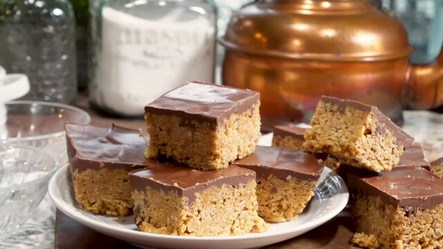 Baking rice krispy treats with butterscotch and chocolate on top. Fun chocolate sweet treats for grown ups and kids.  Chocolate rice krispy treats.